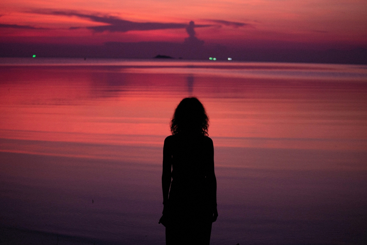 Photocredit by Alexey Demidov on Unsplash A woman facing the sea. The results of this situation yield a dark and dull reality. There was no income perspective and no hope on the horizon.